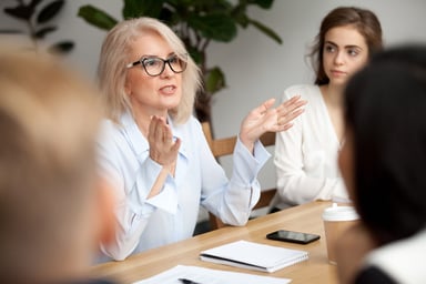 person speaking passionately in meeting