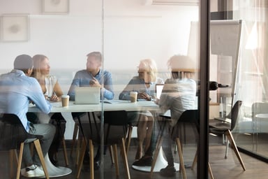 people sitting in a meeting room at work