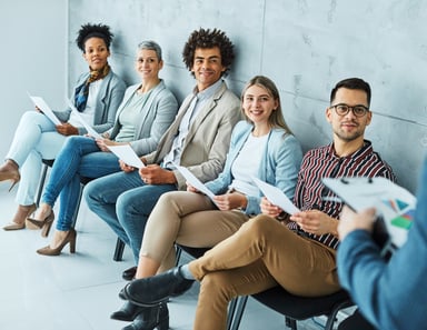 people waiting to be interviewed for a job