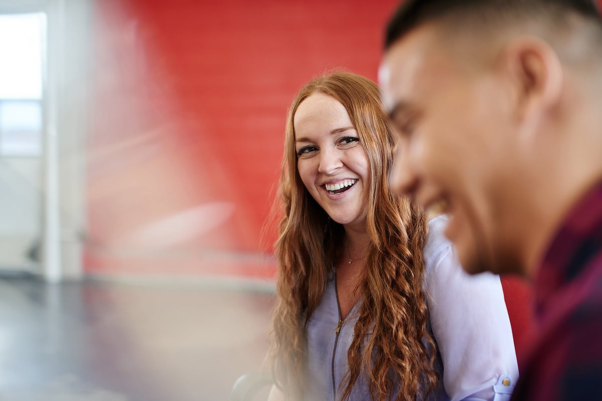 two people chatting and laughing