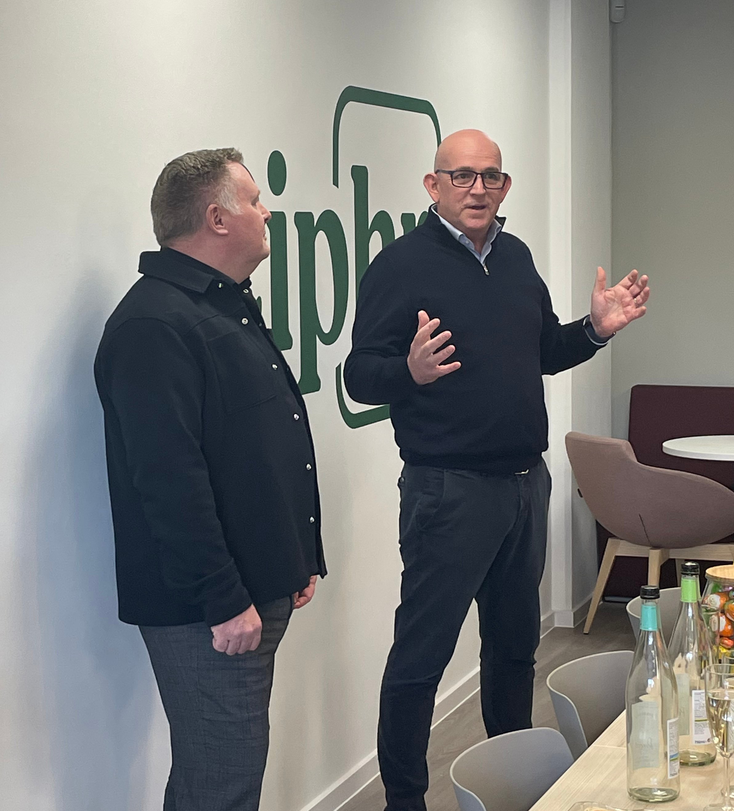 Jason Davenport, CEO of the Chartered Institute of Payroll Professionals, with Sion Lewis, CEO of Ciphr, at the official opening of Ciphr’s Reading office