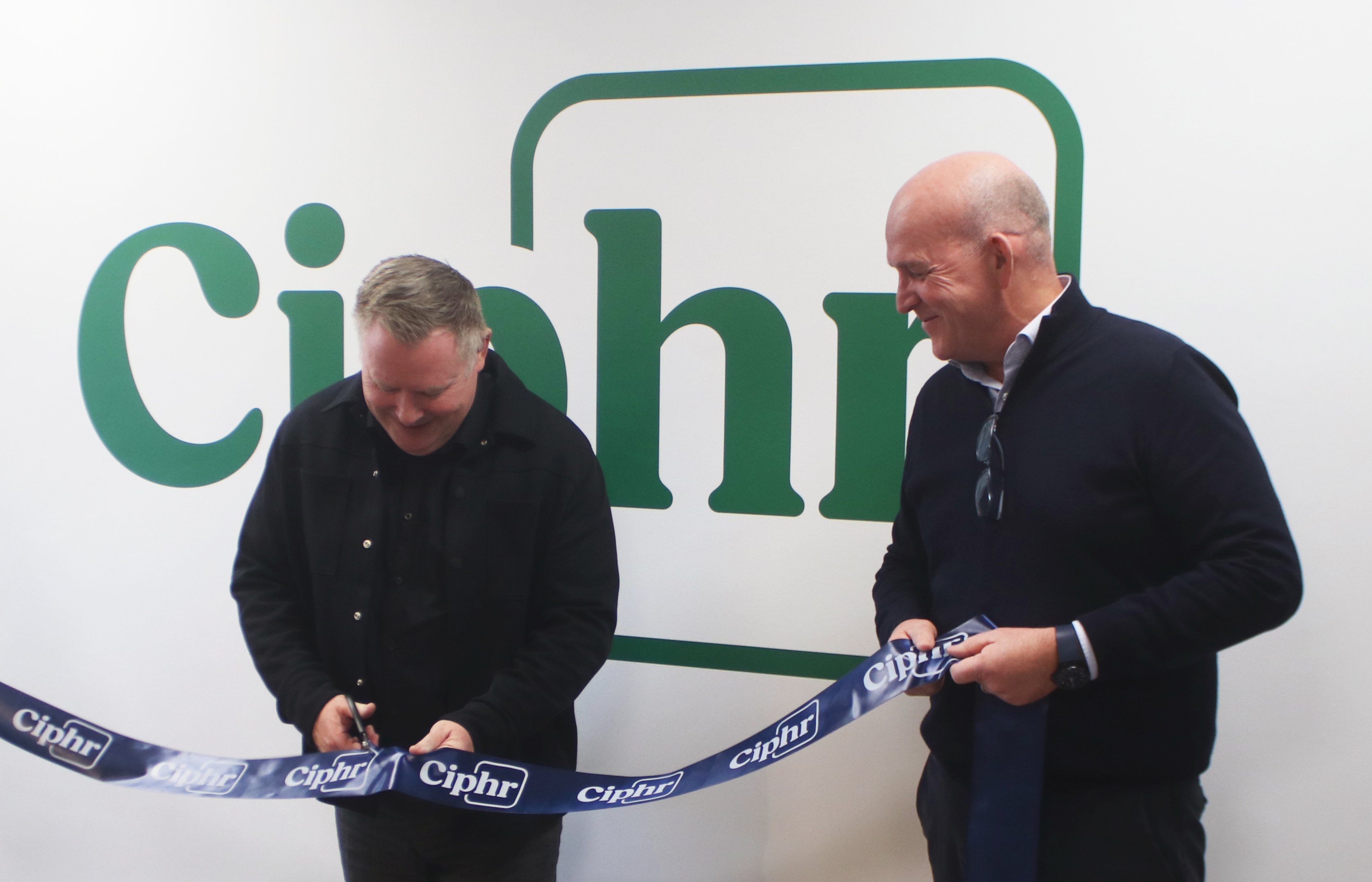 Jason Davenport, CEO of CIPP, ribbon cutting with Sion Lewis, CEO of Ciphr